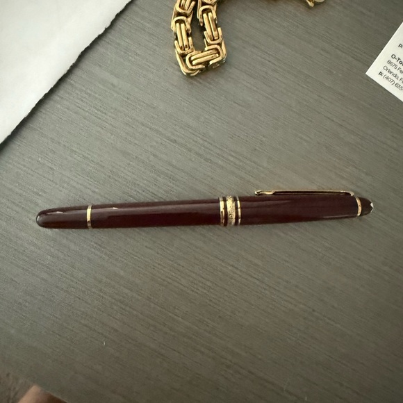 Montblanc Burgundy and Gold rollerball pen
New in box - Picture 2 of 5